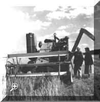 Lord and Lady Iveagh talking with Jack Turner - driving a Massey Harris combine